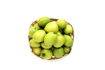 Green jujube fruits on white background.