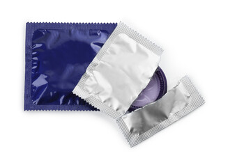 Packaged condoms on white background, top view. Safe sex