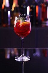 Glass of delicious refreshing sangria on counter in bar