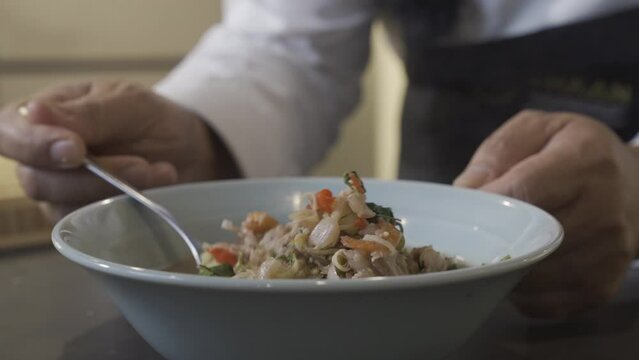 Close up to boiled and fried Pork Thai Menu with Shrimp Paste in white bowl that ready to serve and eat.