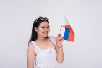 Portrait of a proud FIlipina woman waving the Philippines national flag. Patriotic young lady proud of her roots. Isolated on
