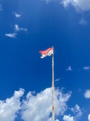 Indonesian flag on blue sky