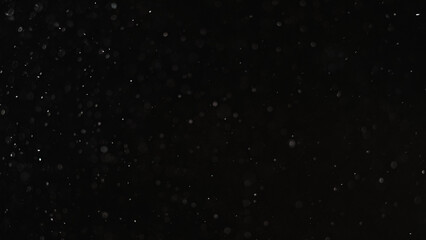 Snow background. Grain texture overlay. Night blizzard. Blur white round flakes particles flying on...