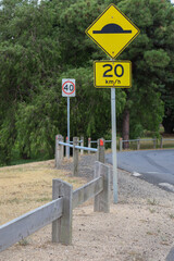 speed limit and speed hump sign