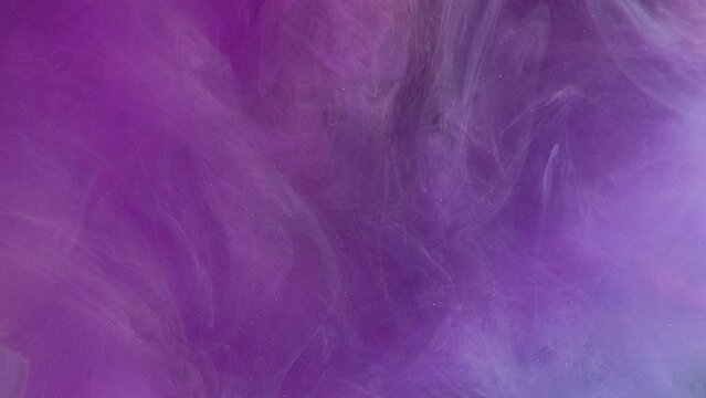 Mist texture. Color smoke. Spiritual aura. Purple haze flow glitter dust particles floating motion abstract art background.
