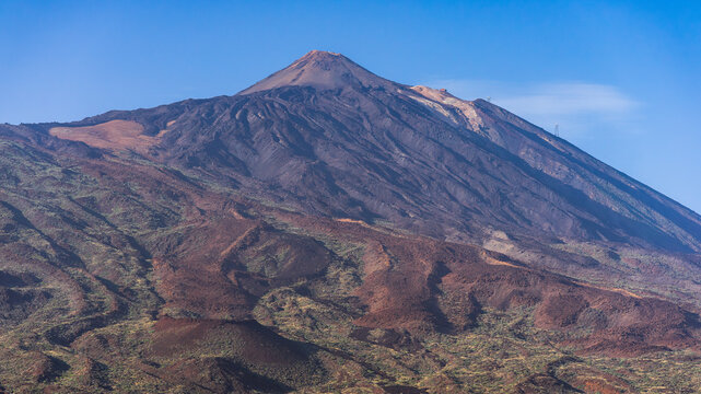 The lava slope of Las Canadas caldera. Viewpoint: Boca Tauce (Mirador de Boca Tauce). In the background is the peak of the Teide volcano. Tenerife. Canary Islands. Spain.