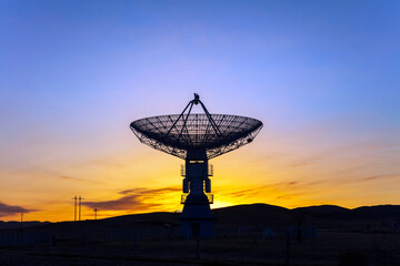 The observatory in the evening, the silhouette of the radio telescope