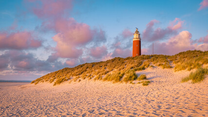 Texell lighthouse during sunset Netherlands Dutch Island Texel in summer with sand dunes at the...