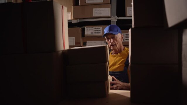 Angry warehouse worker upset throwing box takes inventory of leftover goods, workplace problem concept