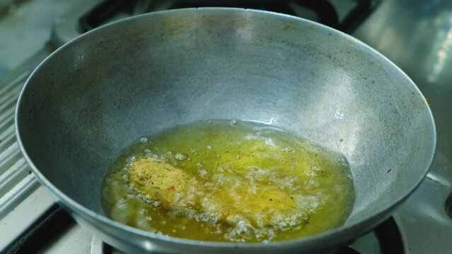  frying Raw Koftas, pakoda in kadai for the vegetable  Kofta curry an Indian Food, 4k, Close up shot 
