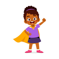 little kid wearing cape and pretending being super hero