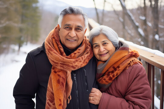 Senior Couple Hugging To Each Other And Enjoying Holiday In Winter Season.