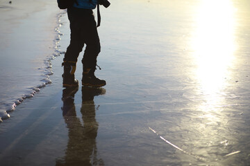 Ice ax - ice screws on winter fishing on the ice caves. Ice is very clean and beautiful. The Lake...