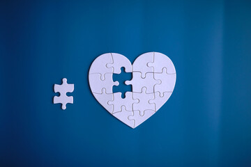 Doctor`s desk in the clinic's office. Stethoscope, puzzle heart, prescriptions on the table.