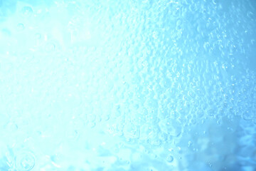 Blue water texture. Bubbles and bubbling water.