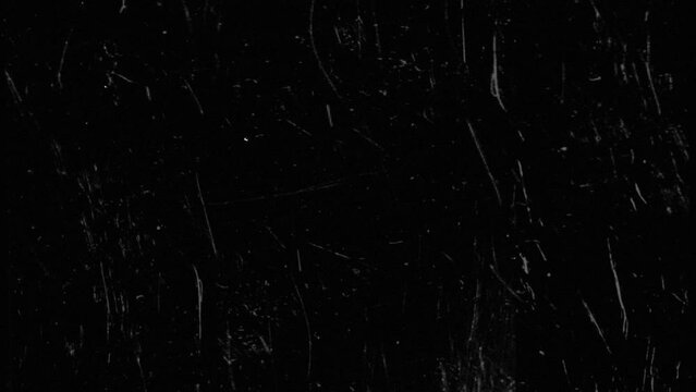 An old film overlay with scratches in a seamless loop.