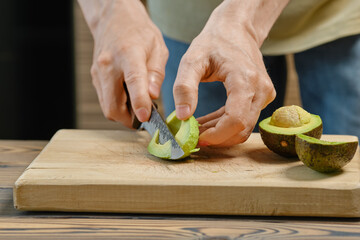 Cutting avocado on slices