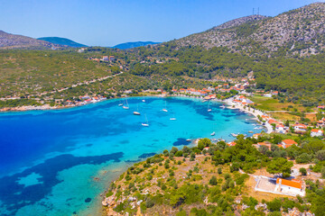 Small fishing village of Posidonio with turquoise blue Aegean sea on Samos island, Greece