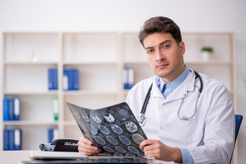 Young male doctor radiologist working in the clinic