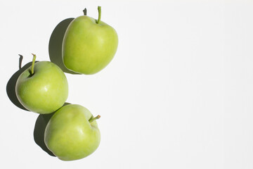 Fresh young green ripe apples isolated on white background top view