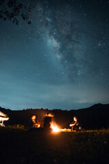 Milky way and bonfire at night