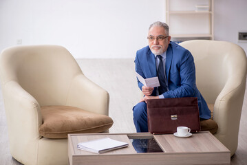 Old businessman waiting for business meeting