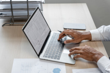 Man working by using a laptop computer&nbsp;Hands typing on keyboard. writing a blog. Working at home are in hand finger typewriter