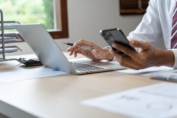 Business man holding Smartphone working mobile devices. cell telephone technology e-commerce smartphone for business work