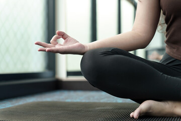 .Easy Seat pose Female Attractive asian woman doing yoga stretching exercise on mat yoga fitness exercises. Healthy lifestyle Calmness and relax