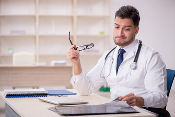 Young male doctor radiologist working in the clinic