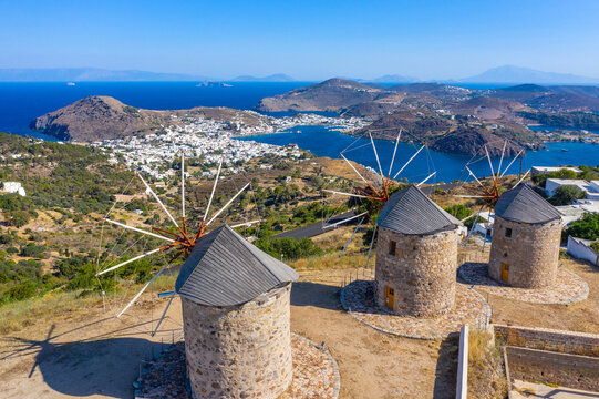 The three windmills of Chora and iconic Monastery of Saint John the Theologian in chora of Patmos island, Dodecanese, Greece