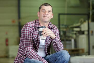 Naklejka premium worker on a break drink coffee and have rest