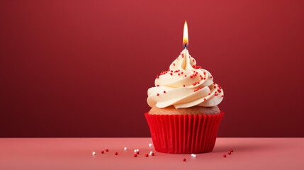 Fresh tasty cupcake with candle on red background
