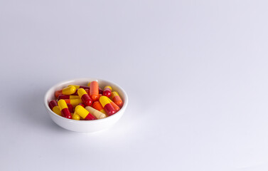 one cup of medicine capsule on white background