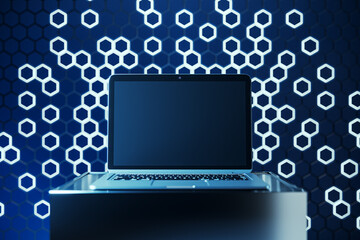 Empty laptop screen on pedestal with mock up place and blue hexagonal background. Creative...