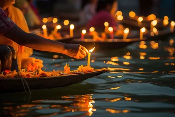 Tuinposter Many diyas lamps floating on the river for celebrating Diwale festive holiday in India © vasanty