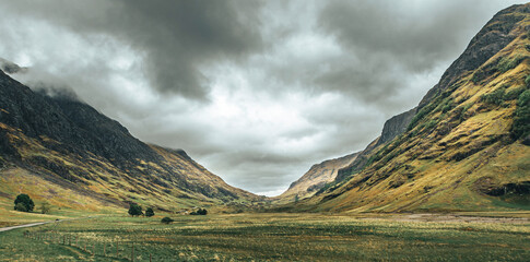 The view of the Scottish Highlands along the highway in overcast weather