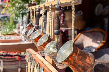 Copper coffee pots jezve (gezve, cezve, ibrik) at the street shop in Bergama, Turkey (Turkiye)....