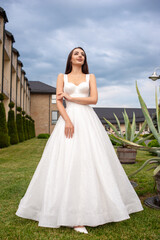 Fototapeta premium Fashion bride in wedding dress. Summer wedding