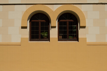 Minimalist Yellow Building with Arched Windows
