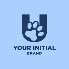 Obraz premium letter U paw print dog foot silhouette in negative space initial vector logo design