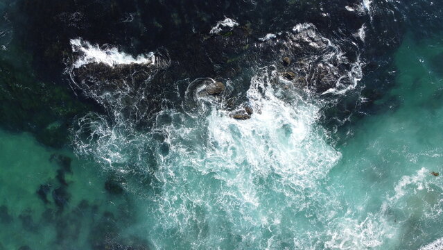 Aerial View of Tide Pools With Sea Foam and Ocean Waves