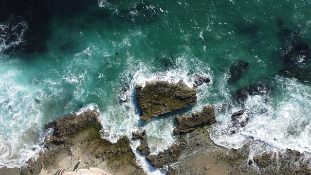 Aerial View of Tide Pools With Sea Foam and Ocean Waves