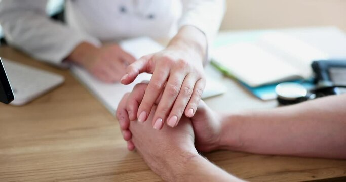 Female doctor therapist oncologist patient hand sympathy support and compassion. Medicine and treatment trust