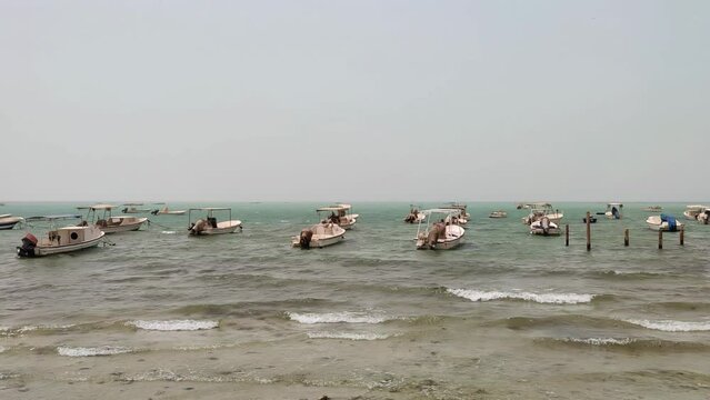 Wave collapsing Persian Gulf ocean, Boats at beach, Sea wave, Kingdom of Bahrain, Middle East