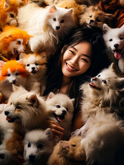 a happy girl laying in a pile of animals