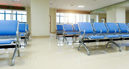 Hospital waiting room with row of empty chairs