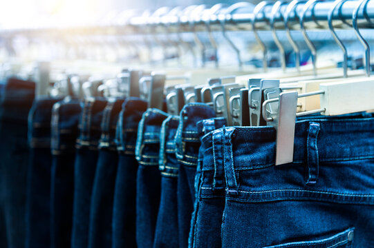 Row of blue jeans in a shop