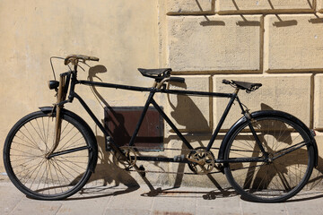 An old two-seater bicycle in Pitigliano. Italy