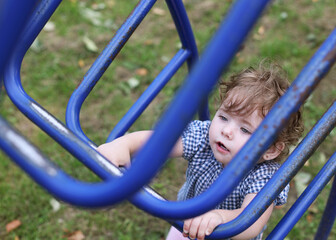 Obraz premium Children's playground in the village, recreation for children. Carousels and other children's entertainment. Swings for children to play. Play outdoors. A small amusement park.